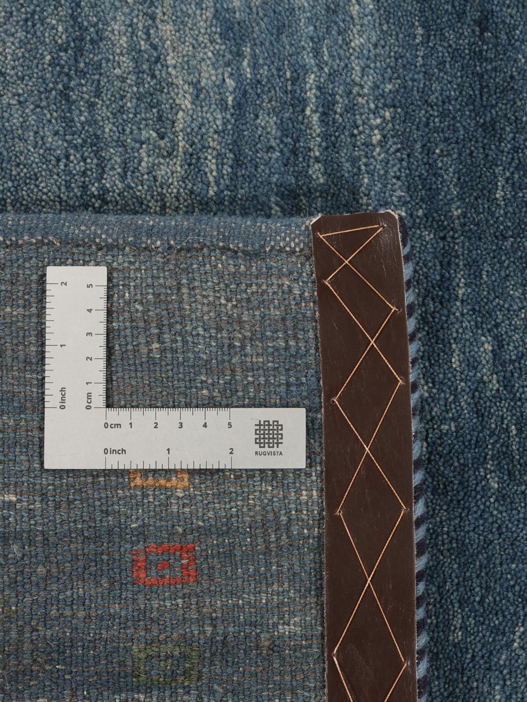 A rectangular hand-knotted Gabbeh Fine rug from the Middle East in deep blue