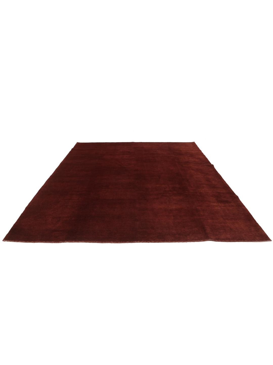 A deep dark-red hand-knotted Gabbeh Fine rug from the Middle East.