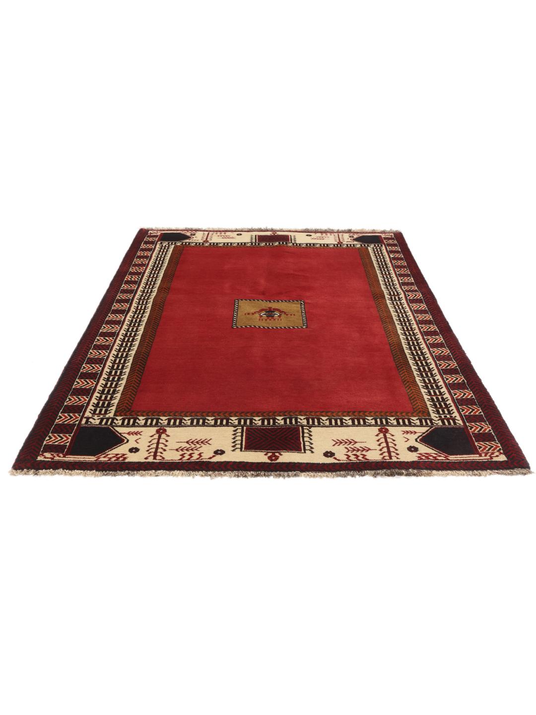 Hand-knotted Qashqai rug from the Middle East in vibrant red with geometric motifs