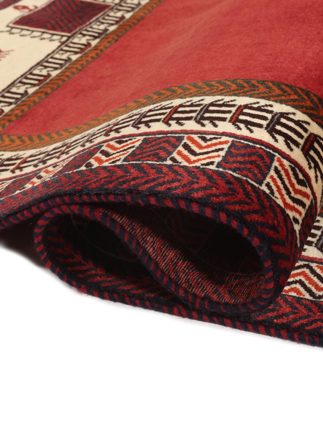 Hand-knotted Qashqai rug from the Middle East in vibrant red with geometric motifs