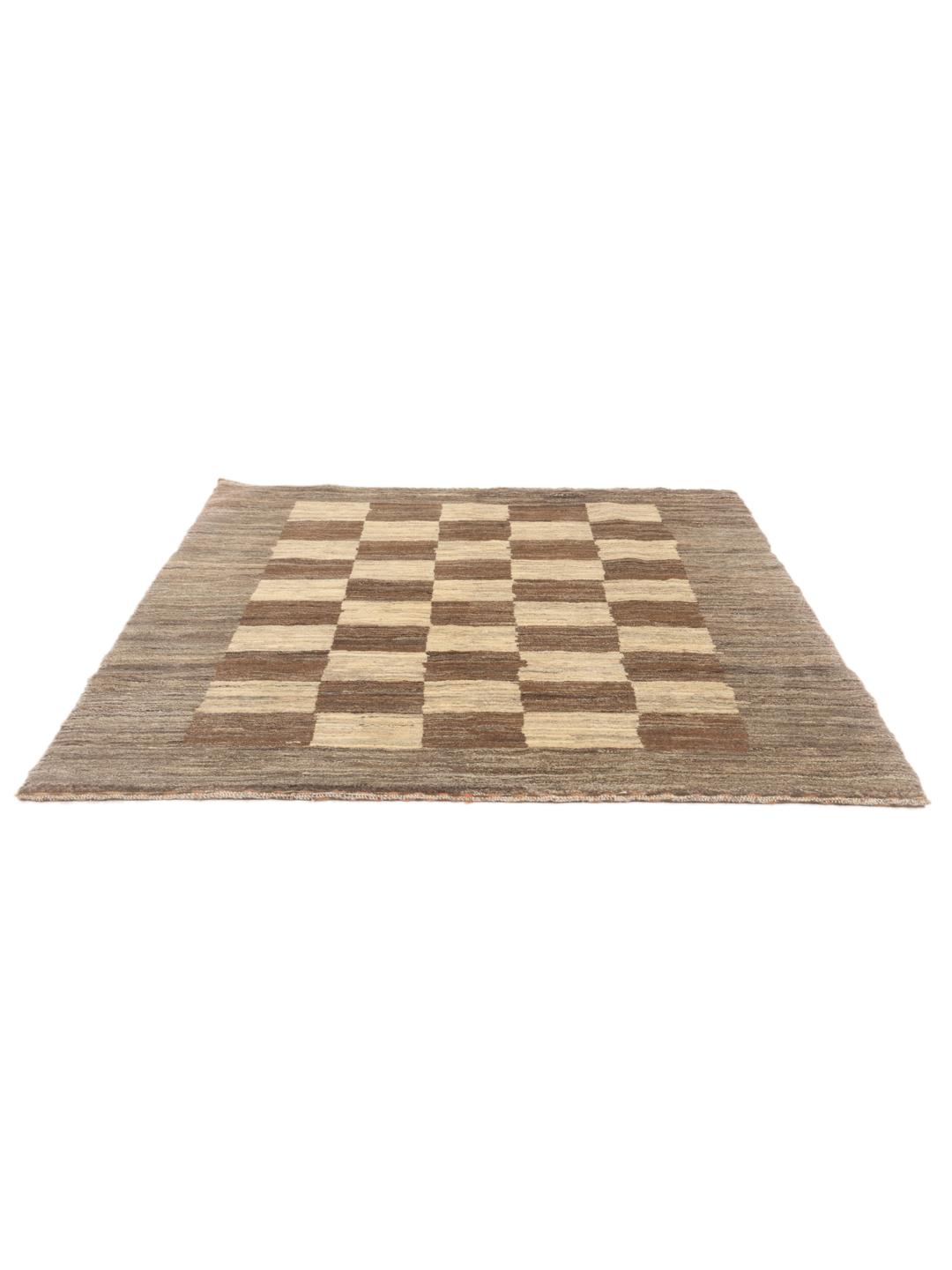 Hand-knotted Gabbeh Fine rug from the Middle East in shades of brown and beige.
