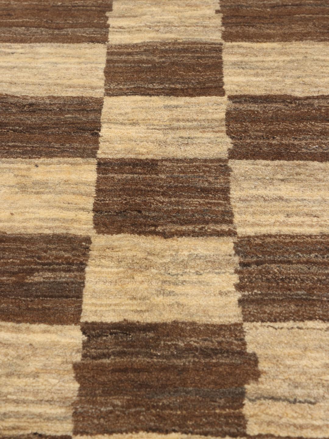 Hand-knotted Gabbeh Fine rug from the Middle East in shades of brown and beige.