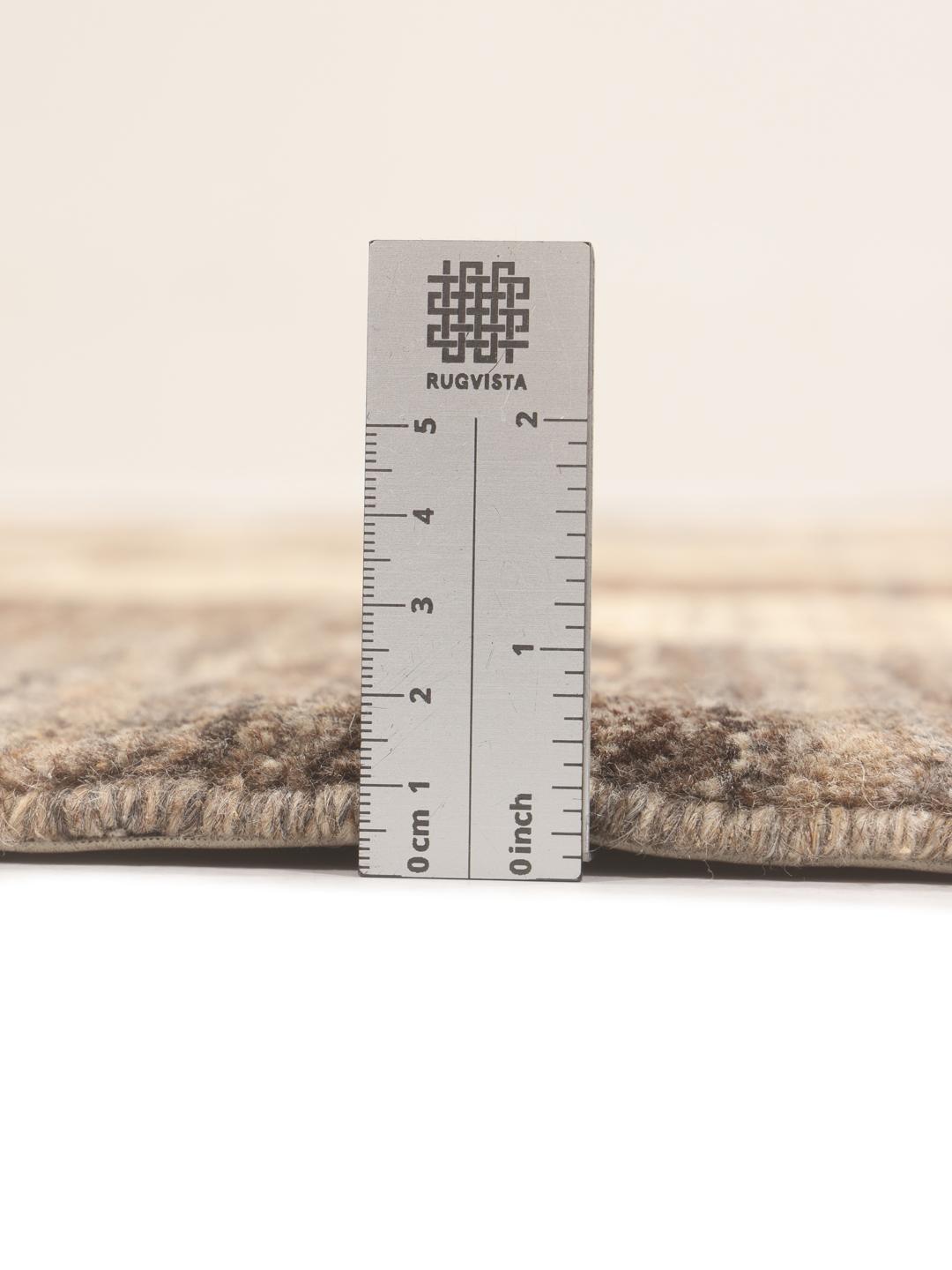 Hand-knotted Gabbeh Fine rug from the Middle East in shades of brown and beige.