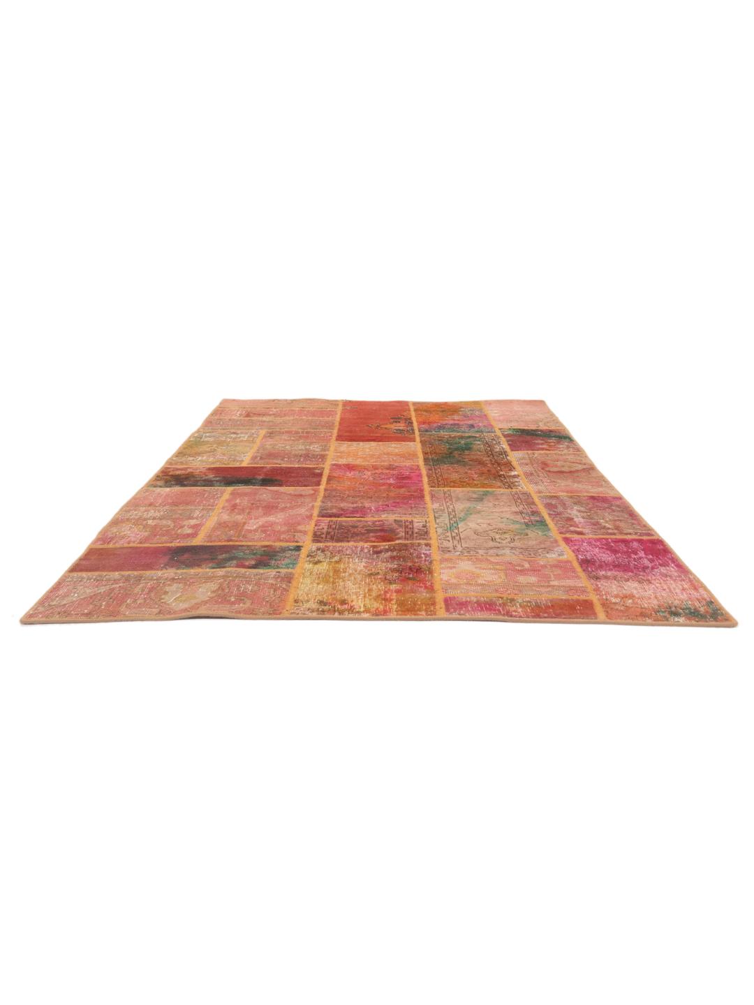 Handmade patchwork rug from the Middle East featuring a vibrant red and multicolor design