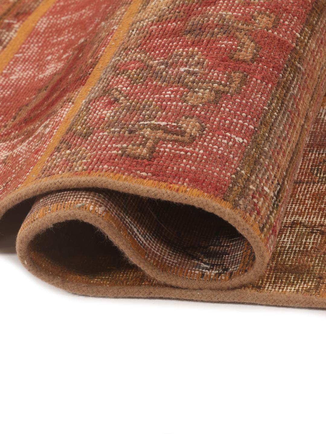 Handmade patchwork rug from the Middle East featuring a vibrant red and multicolor design