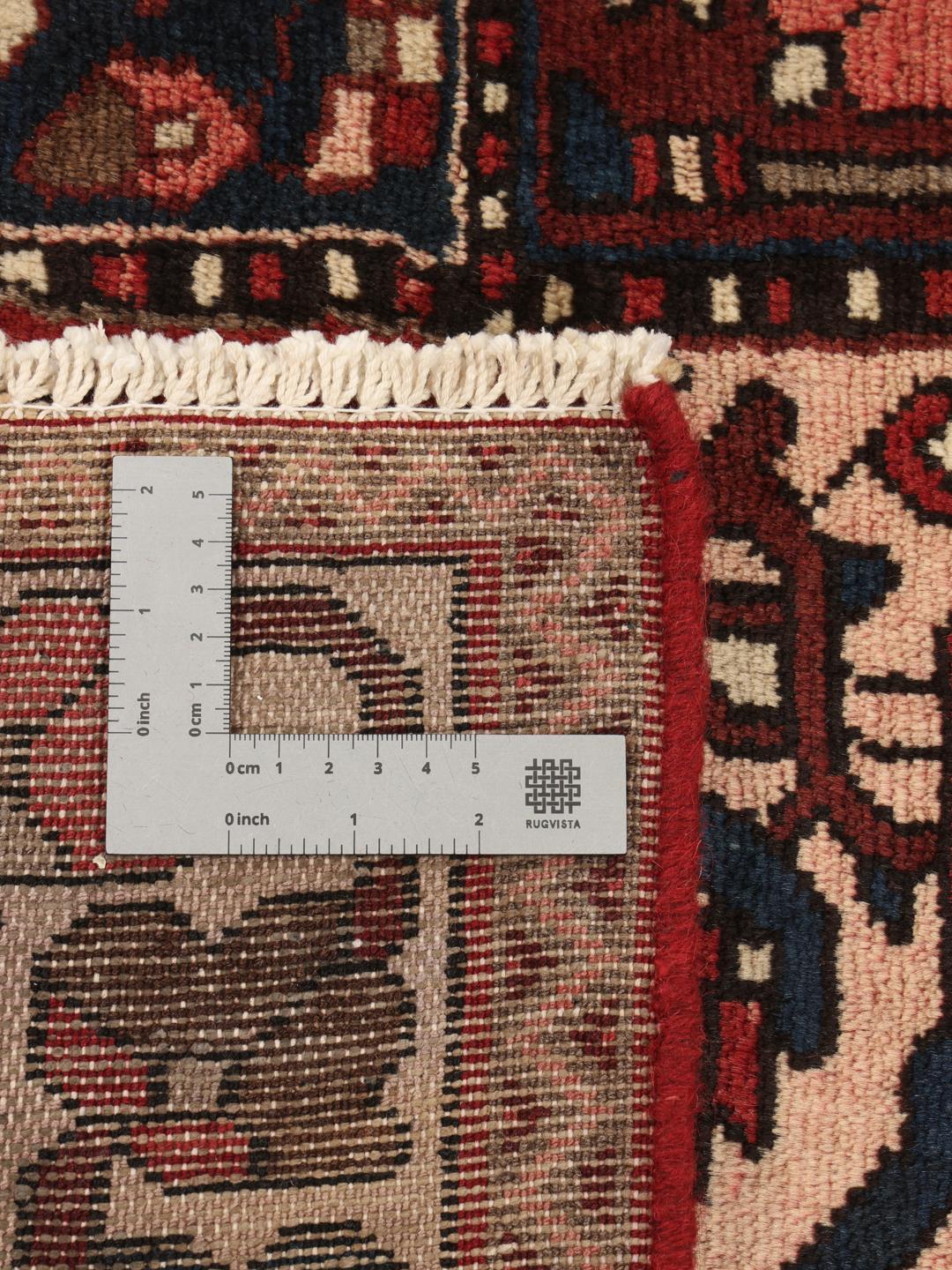 Håndknyttet Bakhtiari-tæppe med et rødt, blåt og cremefarvet havepaneldesign.