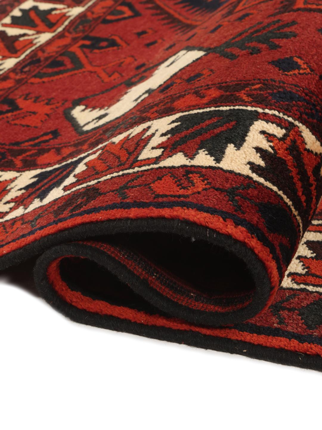Hand-knotted Lori rug from the Middle East in dark red and black tones