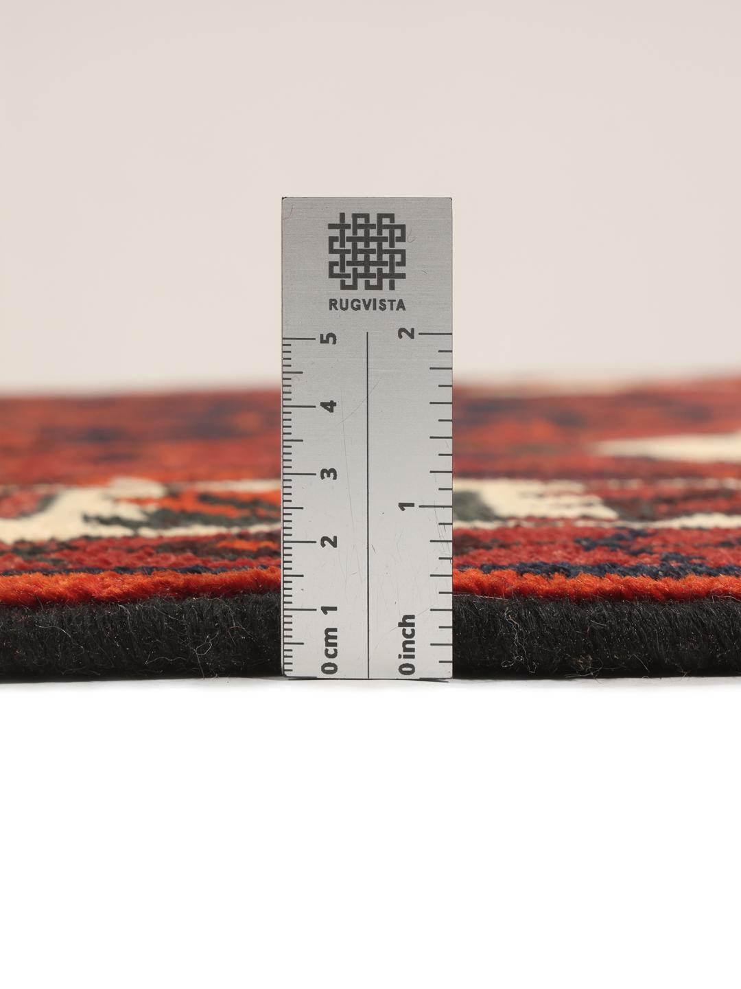 Hand-knotted Lori rug from the Middle East in dark red and black tones