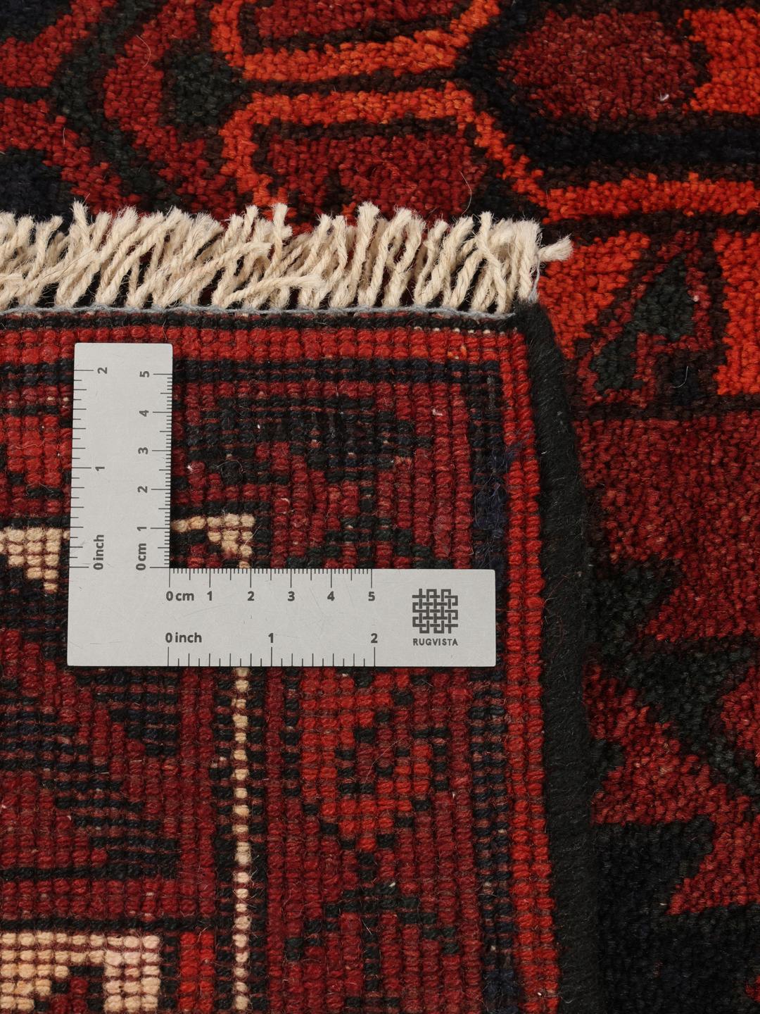 Hand-knotted Lori rug from the Middle East in dark red and black tones