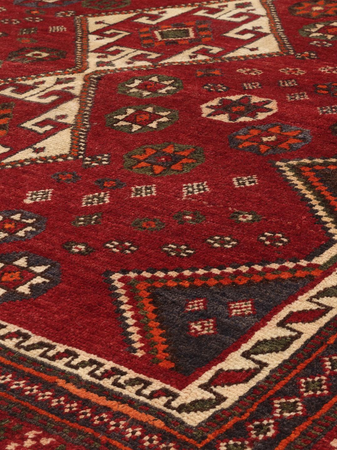 Hand-knotted Ghashghai rug from the Middle East in red