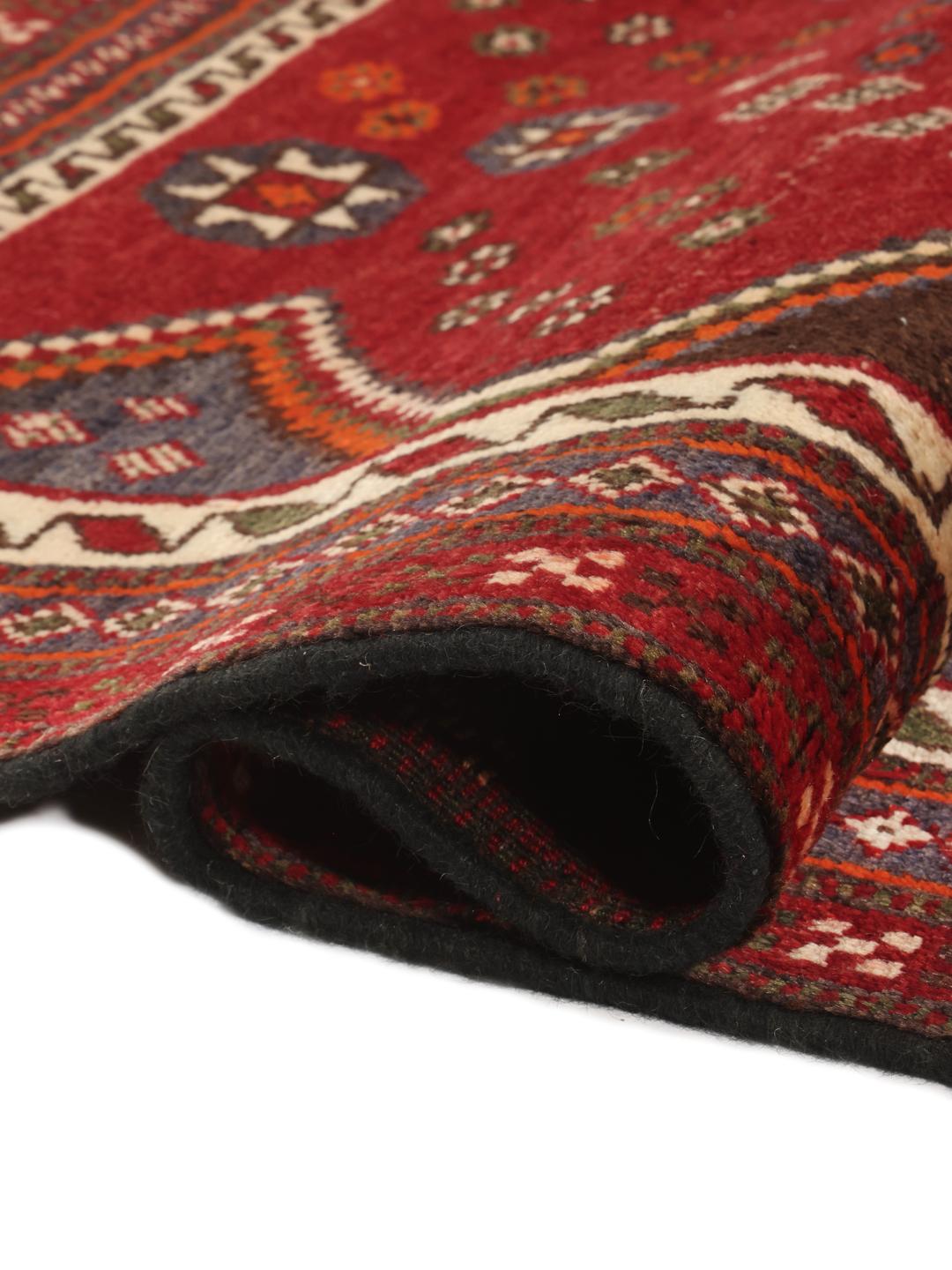 Hand-knotted Ghashghai rug from the Middle East in red