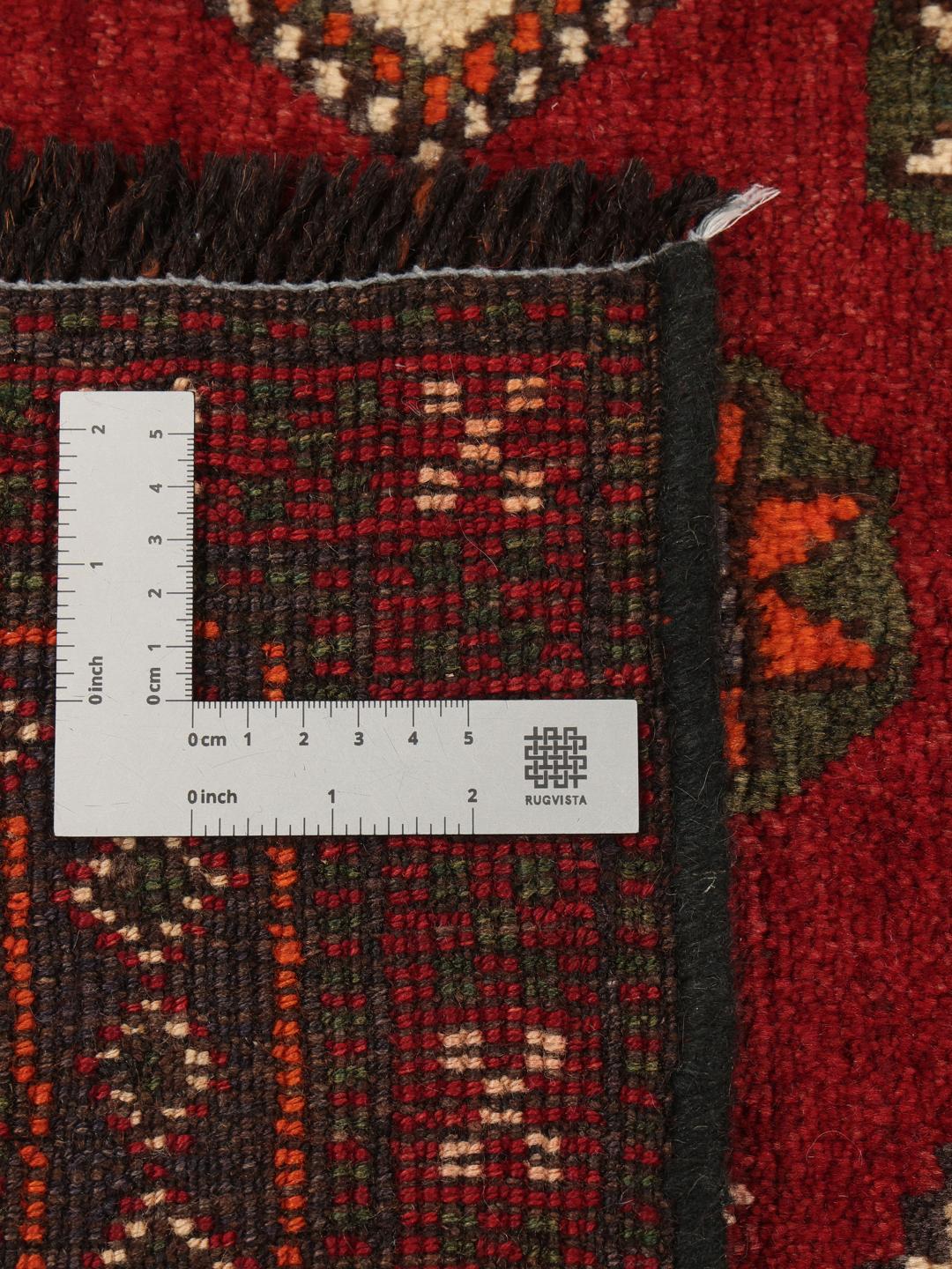 Hand-knotted Ghashghai rug from the Middle East in red