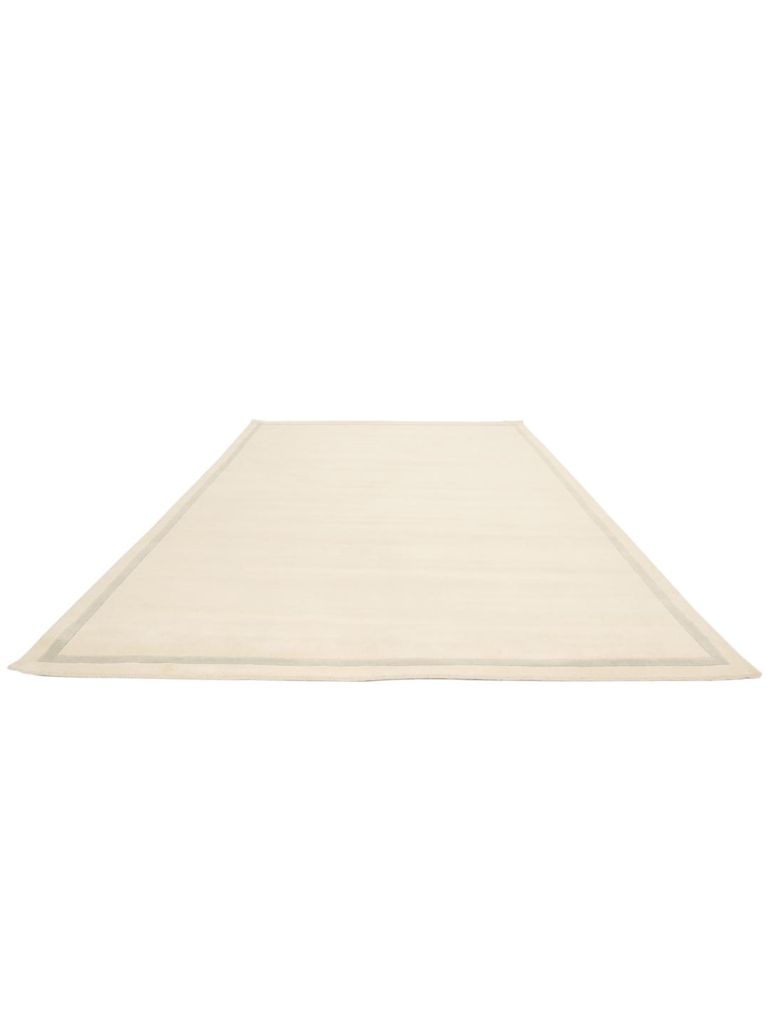 Tapis tissé à la main originaire d'Inde dans une couleur beige neutre avec une bordure subtile