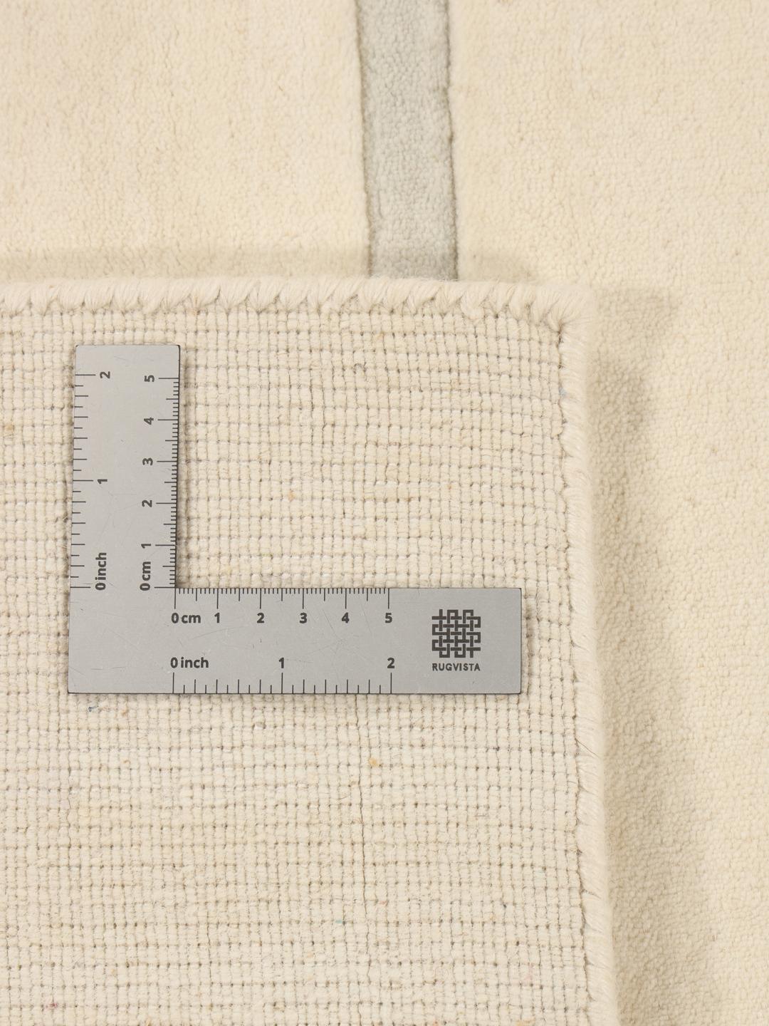 Modern beige handgeweven tapijt met minimalistische lijnen uit India