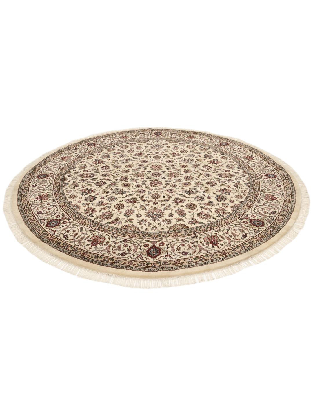 Tapis Sarough rond avec motif floral, noué à la main en Inde dans des tons beige.
