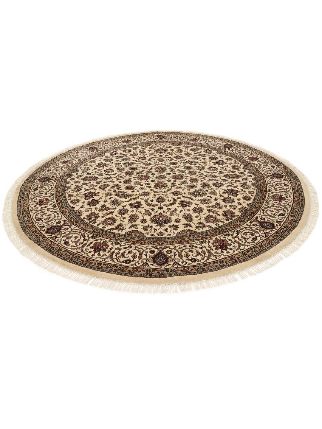 Tapis Sarough rond avec motif floral, noué à la main en Inde dans des tons beige.