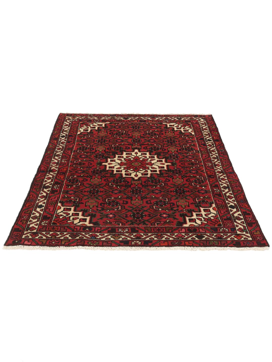 Tapis Hosseinabad noué main en provenance du Moyen-Orient, dans des tons rouge profond avec des motifs géométriques.
