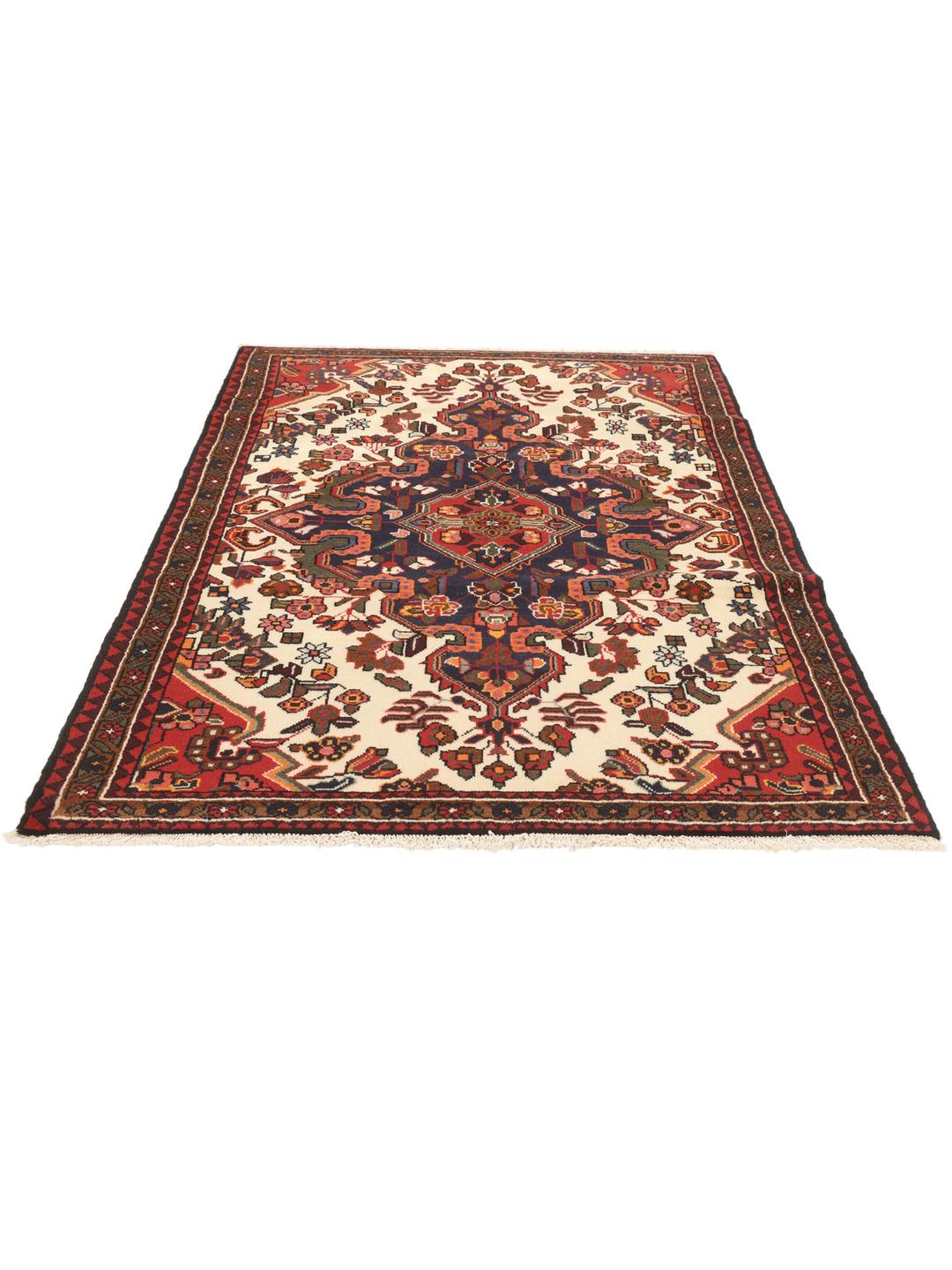 Handgeknoopt Saveh-tapijt uit het Midden-Oosten met een rood en blauw medaillonpatroon op een crèmekleurige achtergrond.