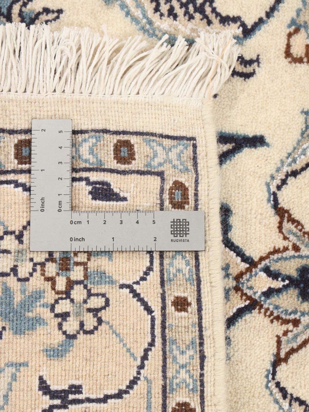 Hand-knotted Nain rug from the Middle East in beige with floral patterns