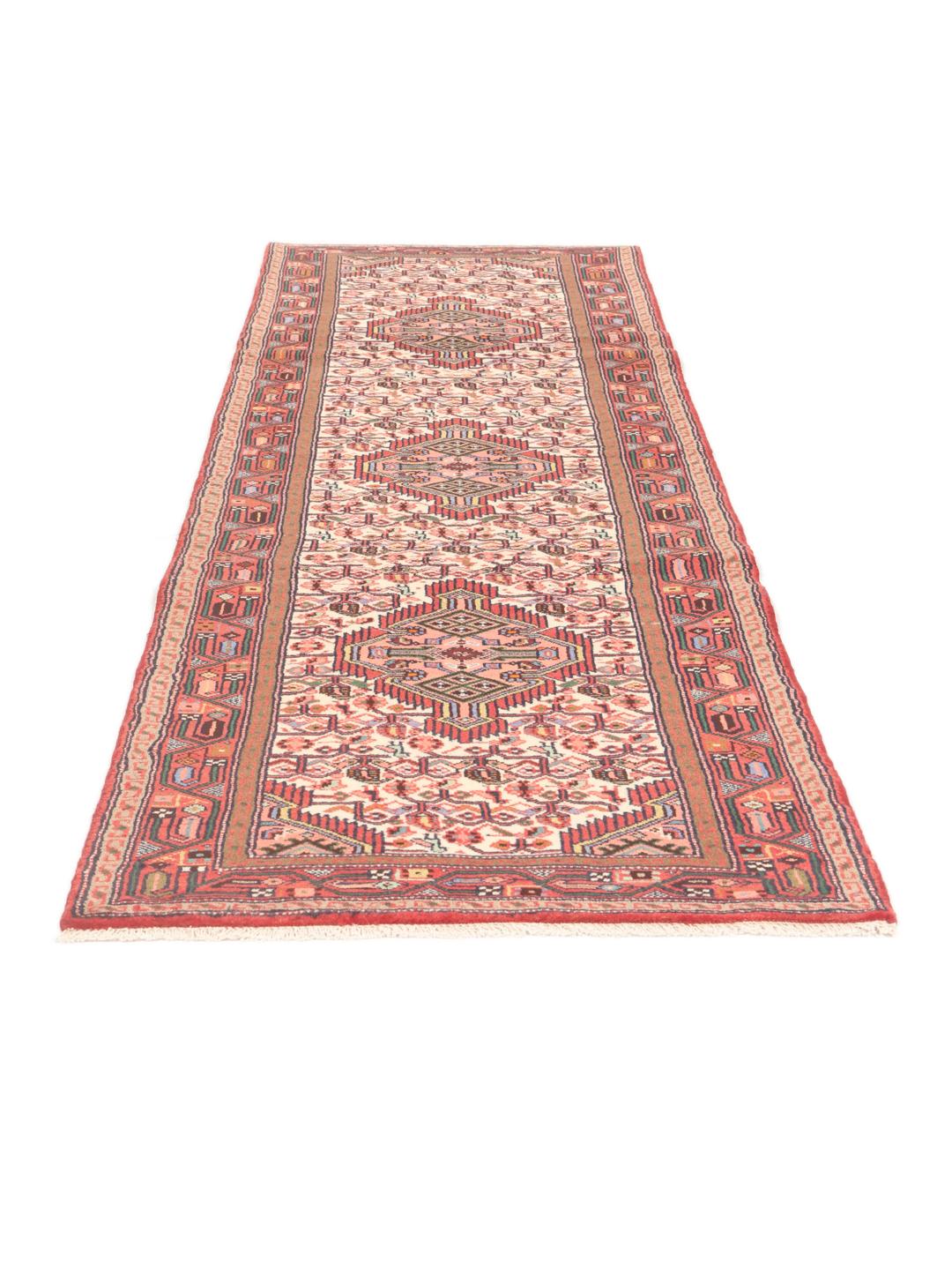 Hand-knotted red runner rug from the Middle East