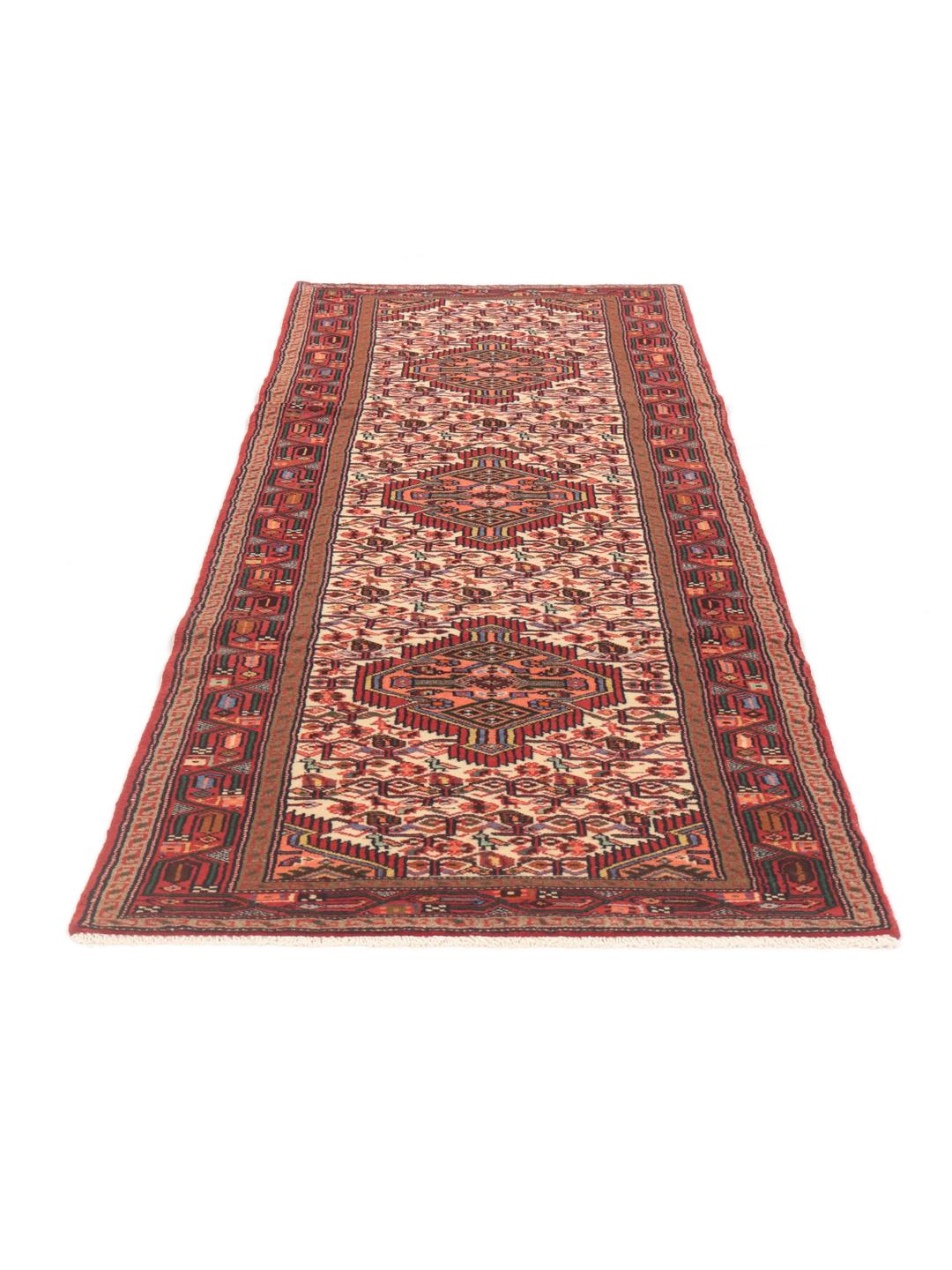 Hand-knotted red runner rug from the Middle East
