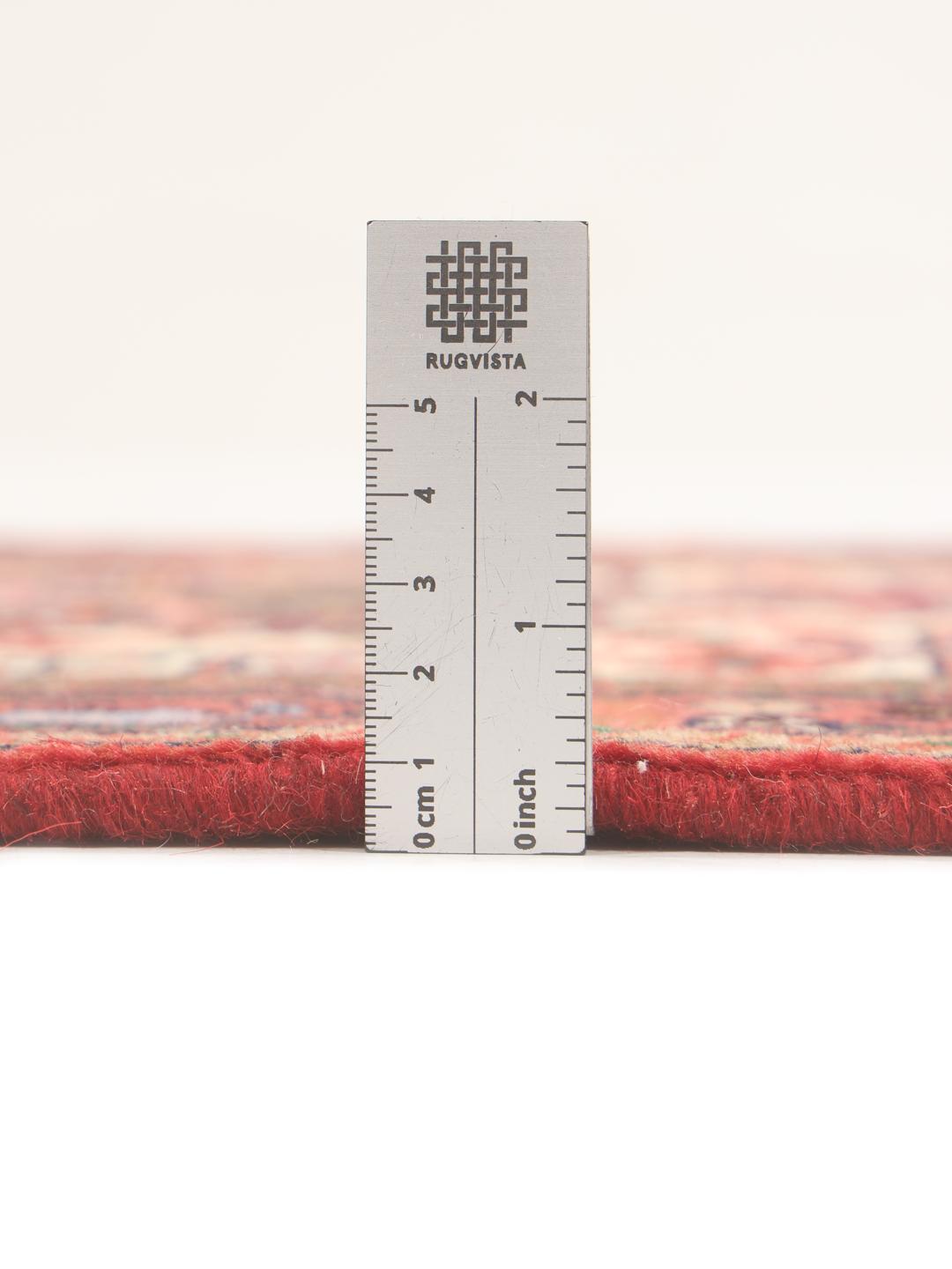 Hand-knotted red runner rug from the Middle East