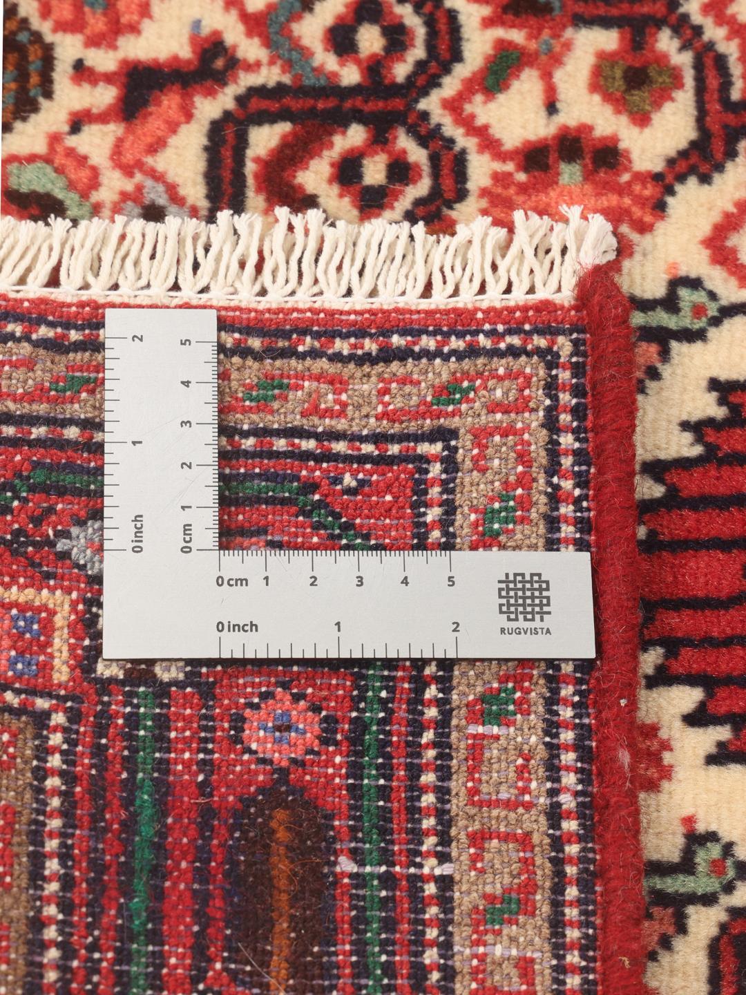 Hand-knotted red runner rug from the Middle East