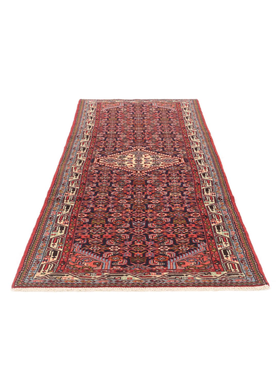 Hand-knotted Asadabad runner with intricate geometric patterns in dark red and blue tones