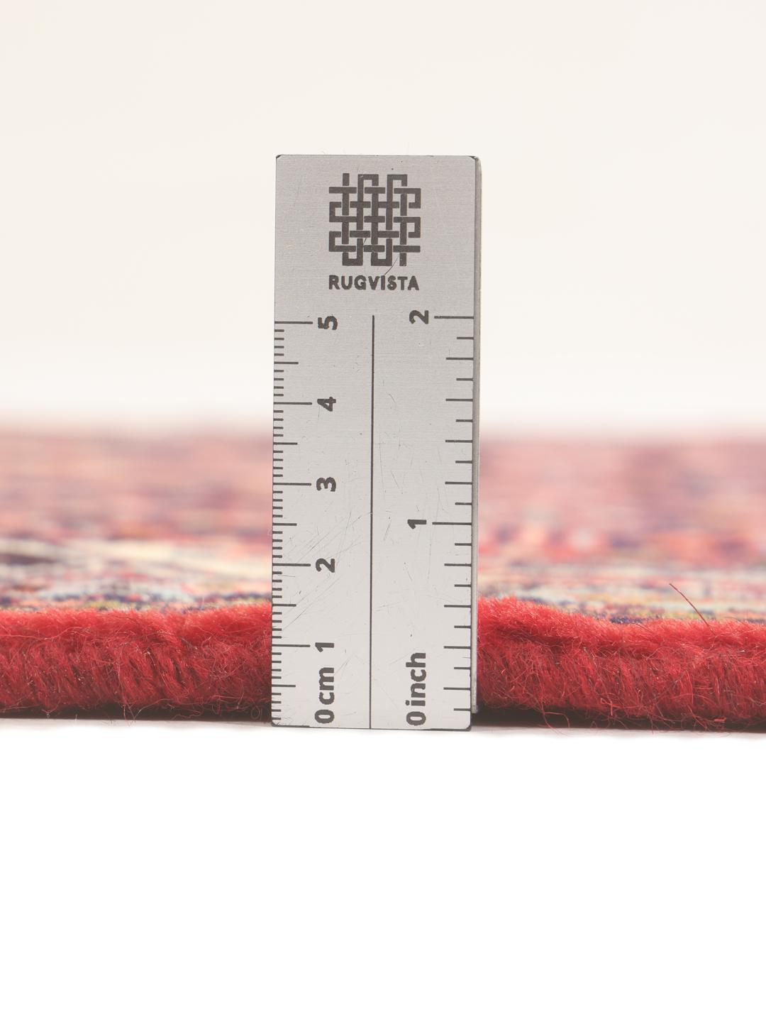 Hand-knotted Asadabad runner with intricate geometric patterns in dark red and blue tones