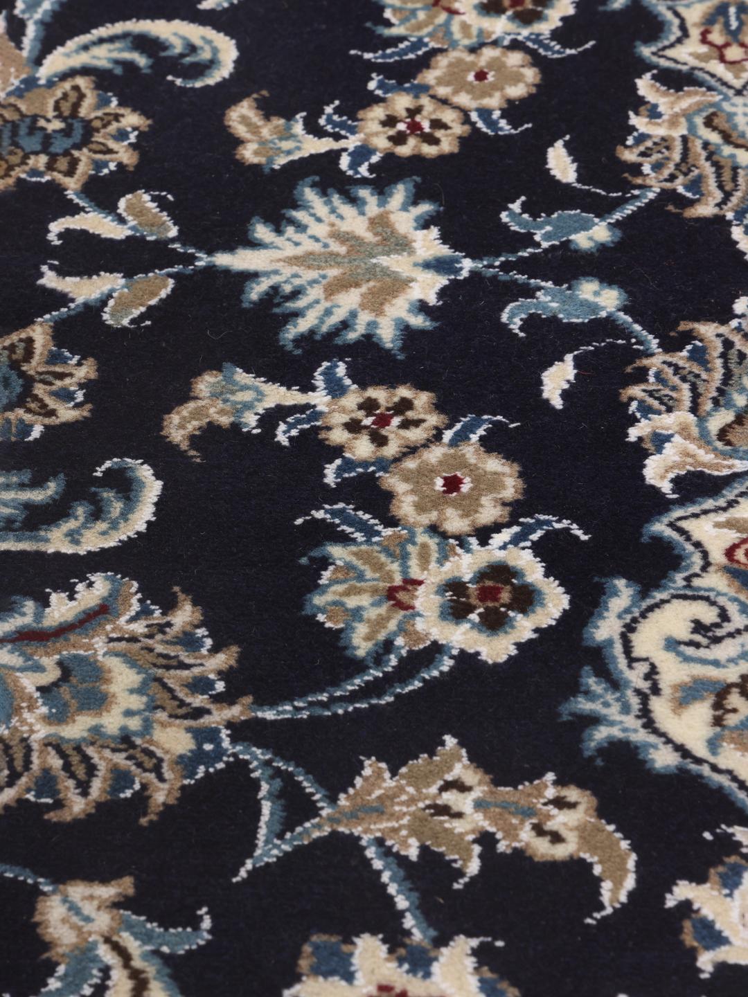 Hand-knotted Nain runner with floral motifs in dark blue