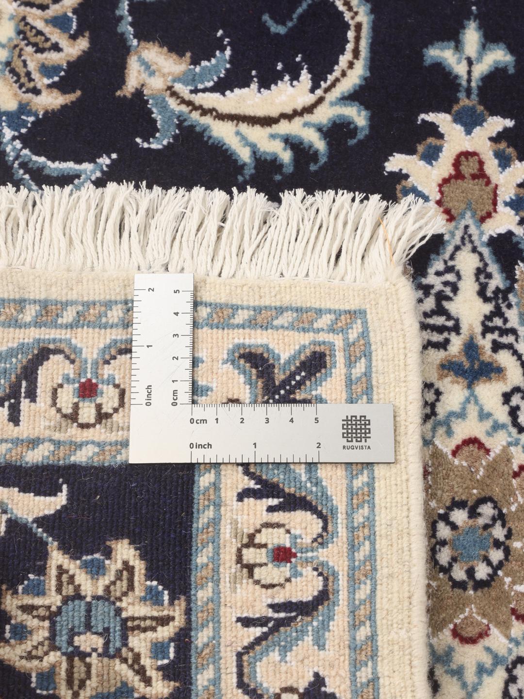 Hand-knotted Nain runner with floral motifs in dark blue