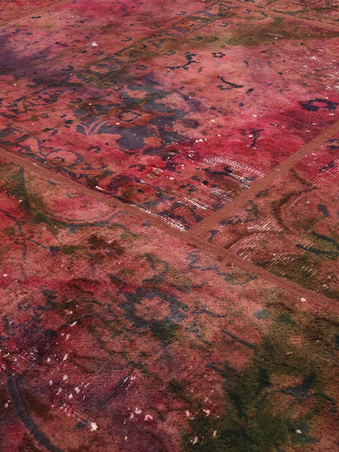 Hand-knotted patchwork rug with a dark-red and dark-green colour palette from the Middle East