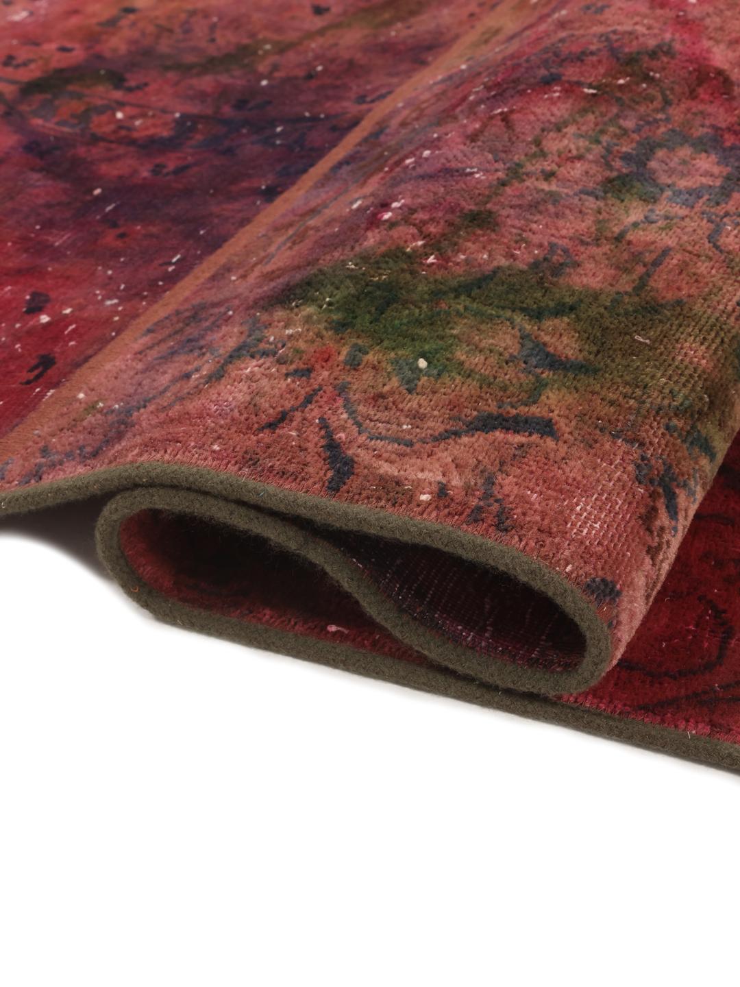 Hand-knotted patchwork rug with a dark-red and dark-green colour palette from the Middle East