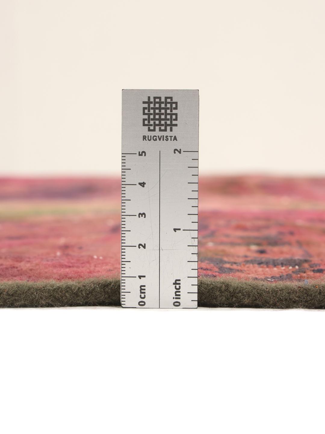 Hand-knotted patchwork rug with a dark-red and dark-green colour palette from the Middle East