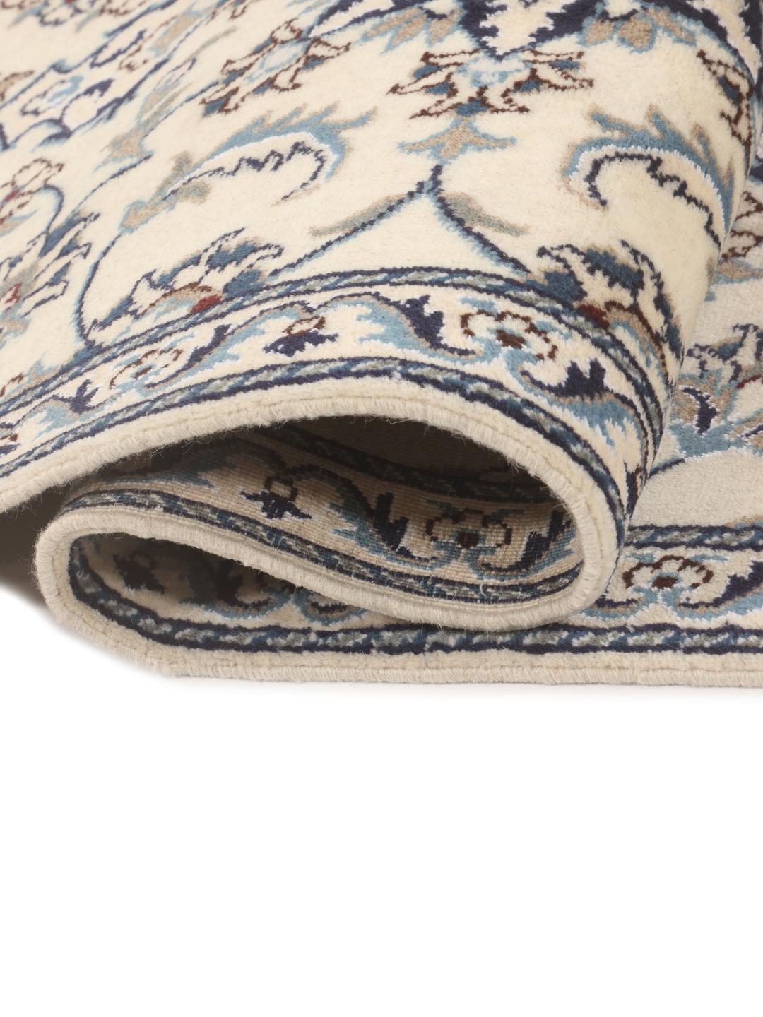 Hand-knotted Nain runner with floral motifs in beige and blue