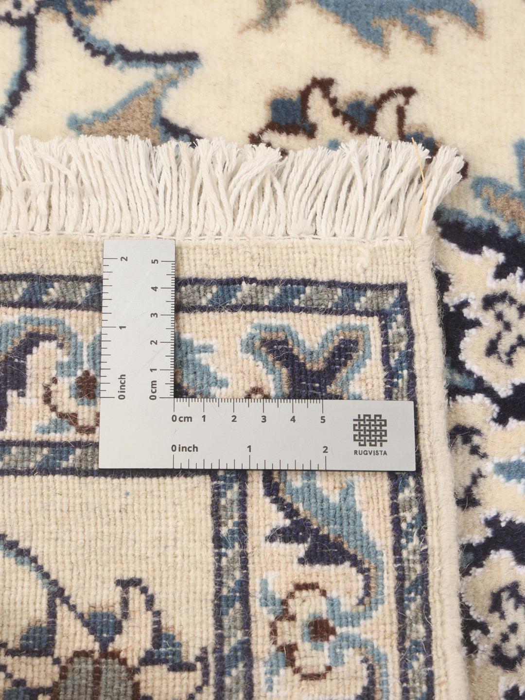 Hand-knotted Nain runner with floral motifs in beige and blue