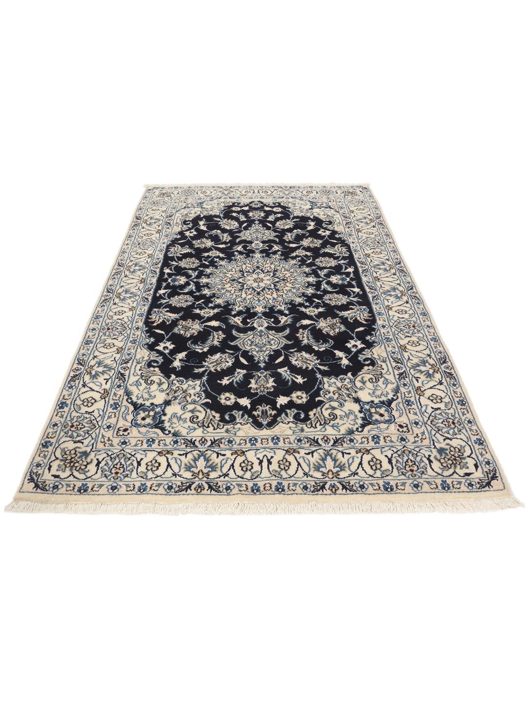 A hand-knotted Nain rug from the Middle East in dark-blue and cream tones.