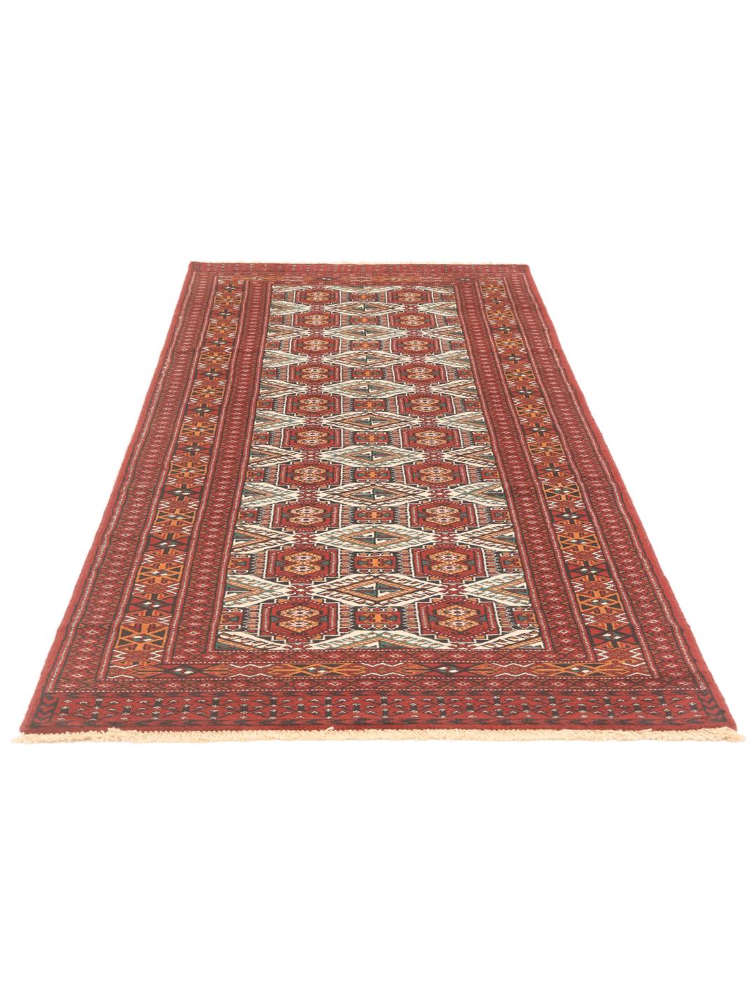 Hand-knotted Turkaman runner with traditional geometric patterns in rich red tones from the Middle East