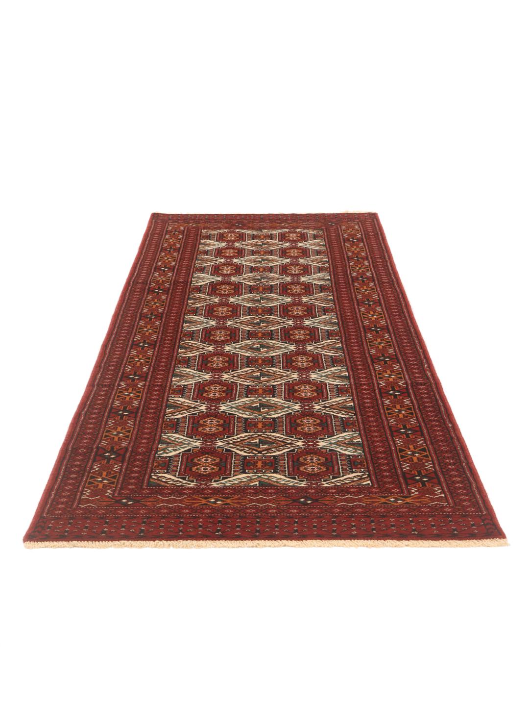 Hand-knotted Turkaman runner with traditional geometric patterns in rich red tones from the Middle East
