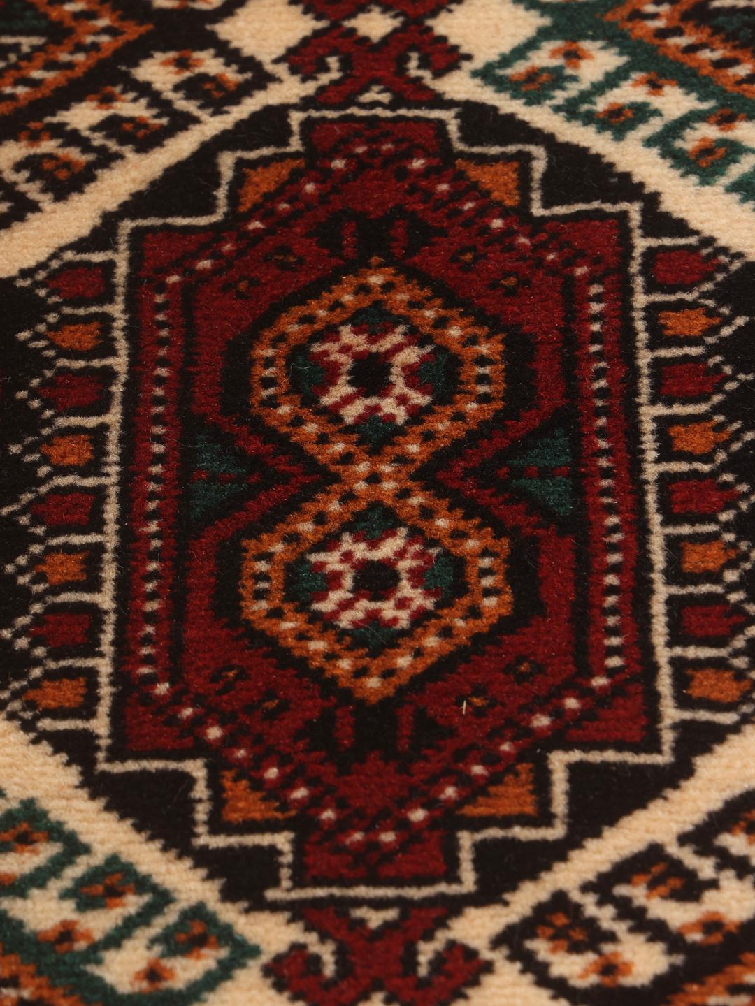 Hand-knotted Turkaman runner with traditional geometric patterns in rich red tones from the Middle East