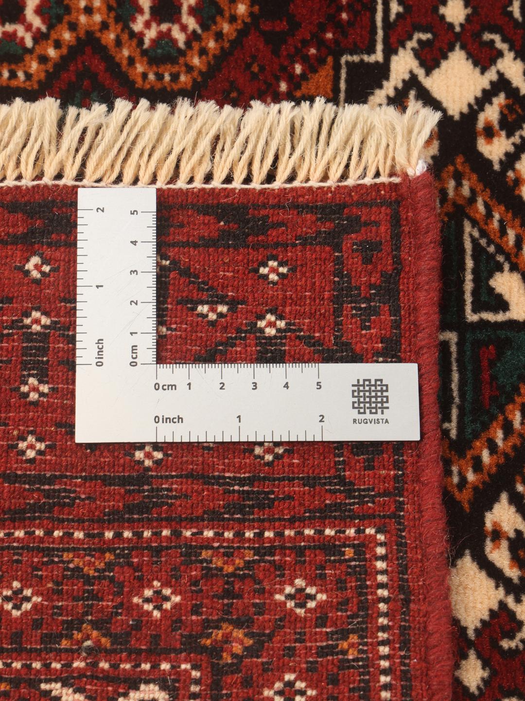 Hand-knotted Turkaman runner with traditional geometric patterns in rich red tones from the Middle East