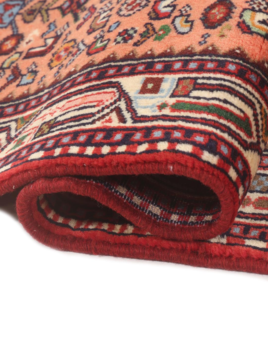 Hand-knotted Middle Eastern runner in red with geometric medallions