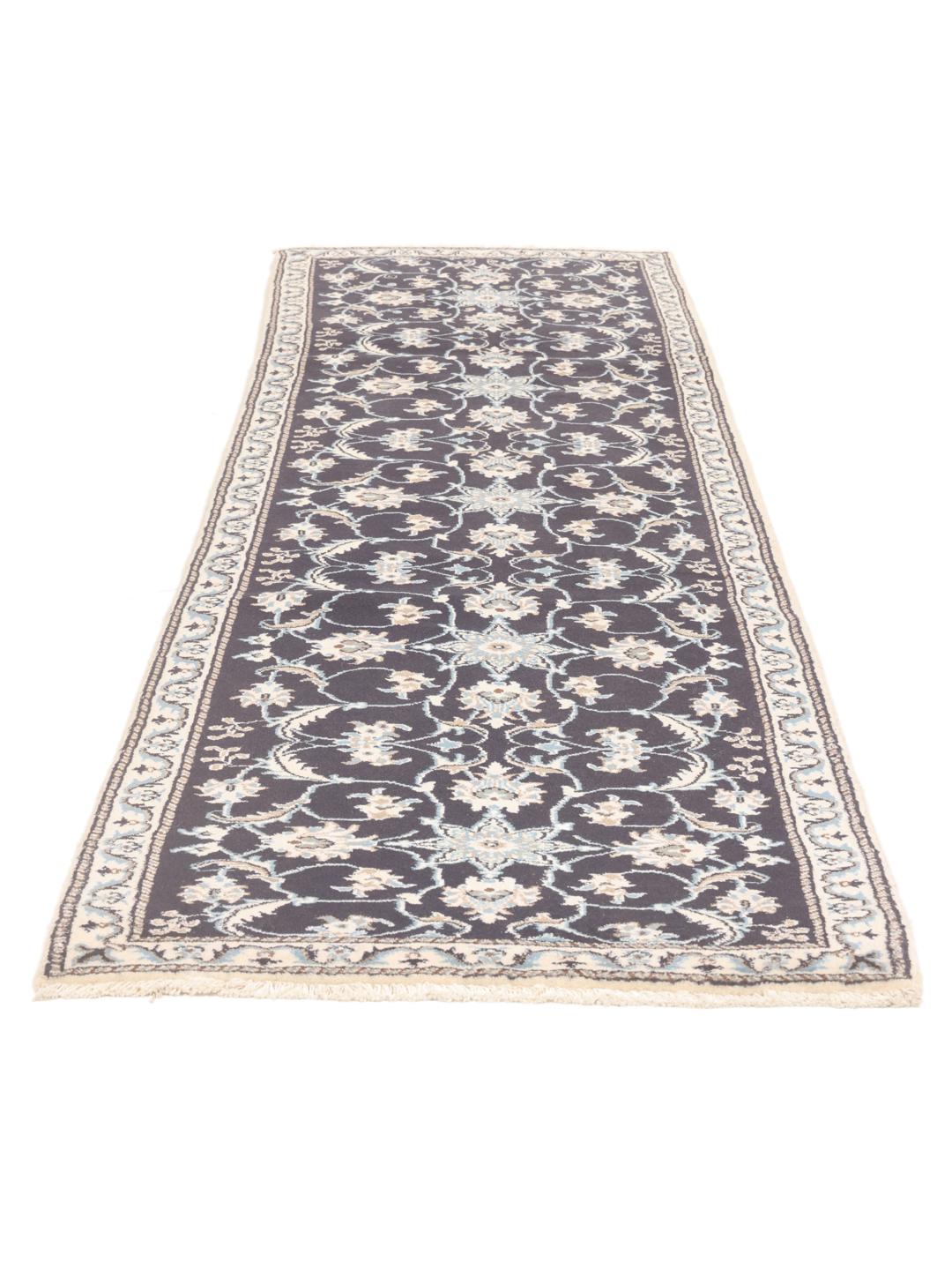 Hand-knotted Nain runner with floral patterns in dark blue and beige tones