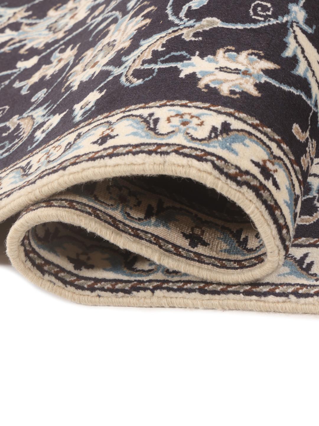 Hand-knotted Nain runner with floral patterns in dark blue and beige tones