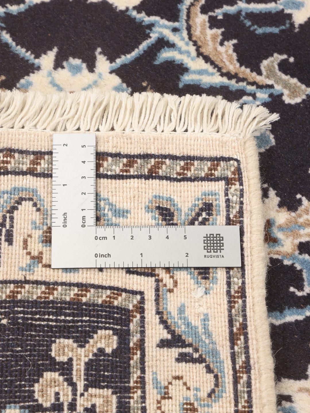 Hand-knotted Nain runner with floral patterns in dark blue and beige tones