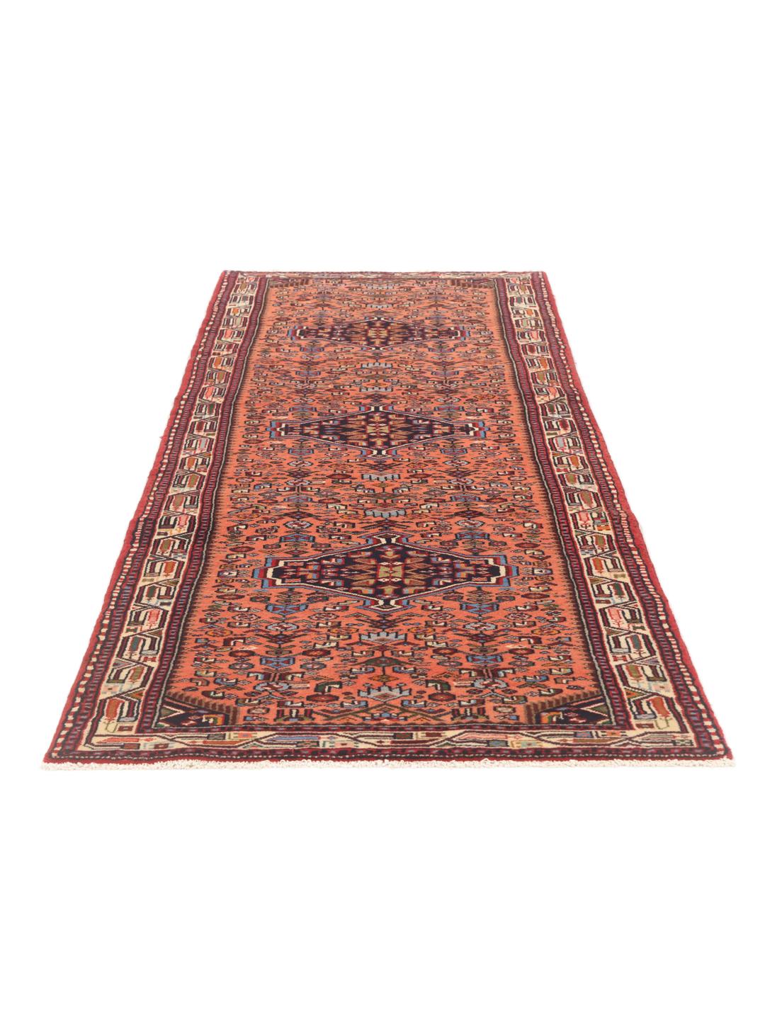 Hand-knotted Middle Eastern runner in red with geometric medallions