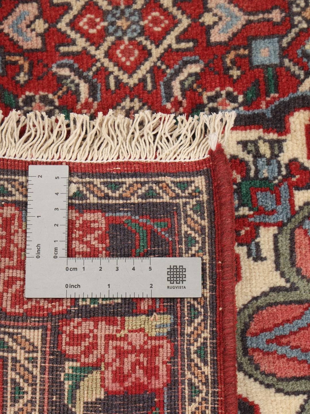 Hand-knotted Bidjar rug from the Middle East in deep red and blue tones