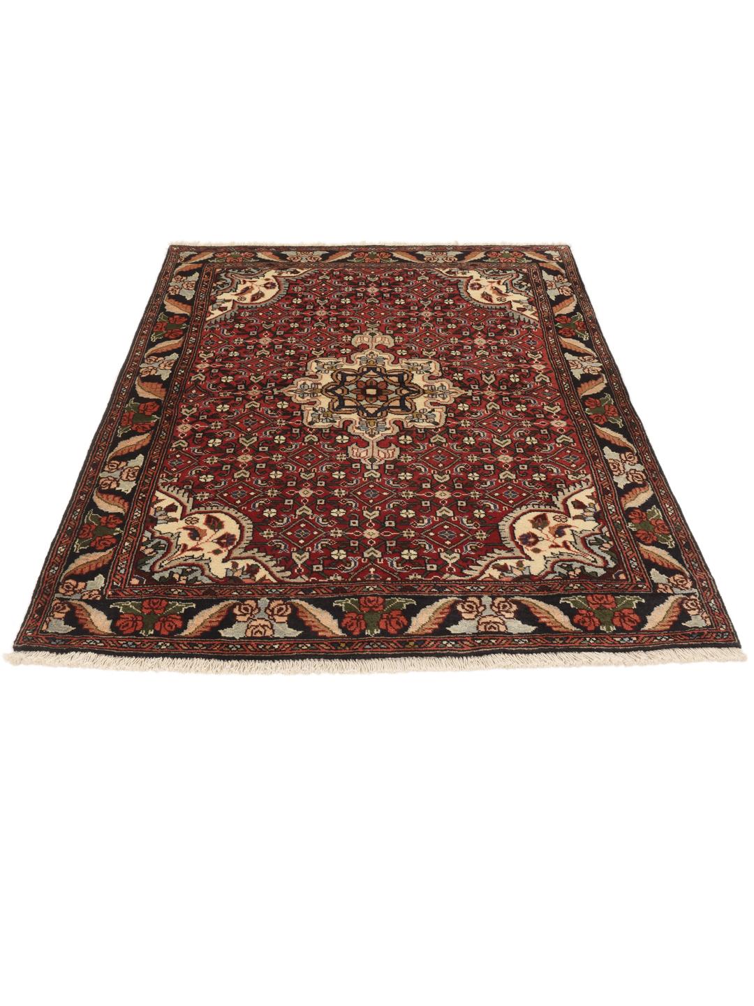 A hand-knotted Bidjar rug from the Middle East with a red field and intricate patterns.