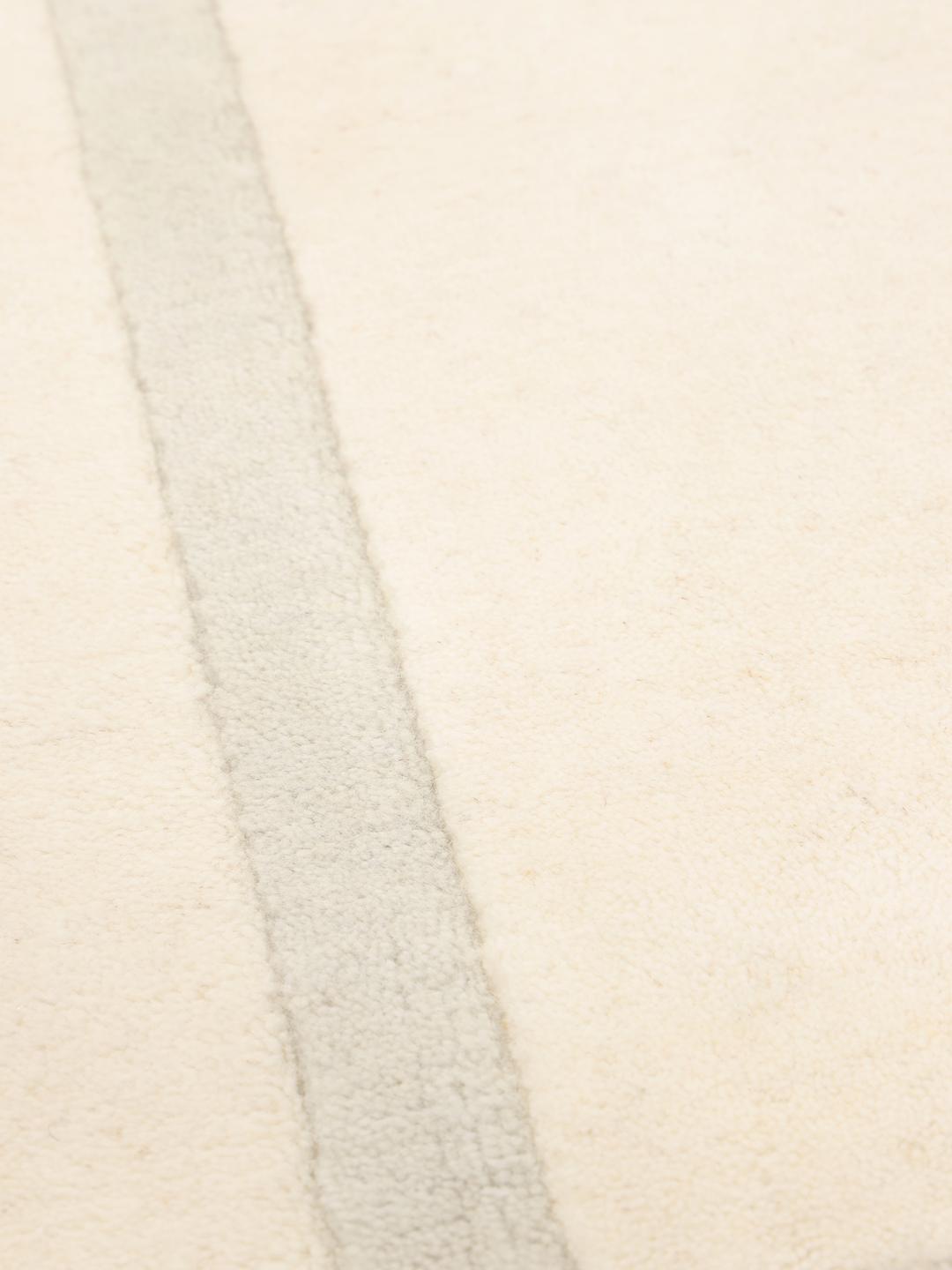 Hand-loomed modern rug from India in beige