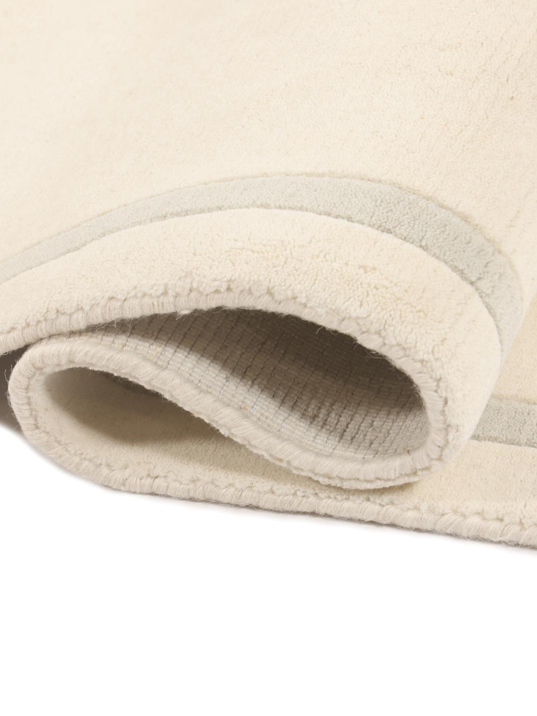 Hand-loomed modern rug from India in beige